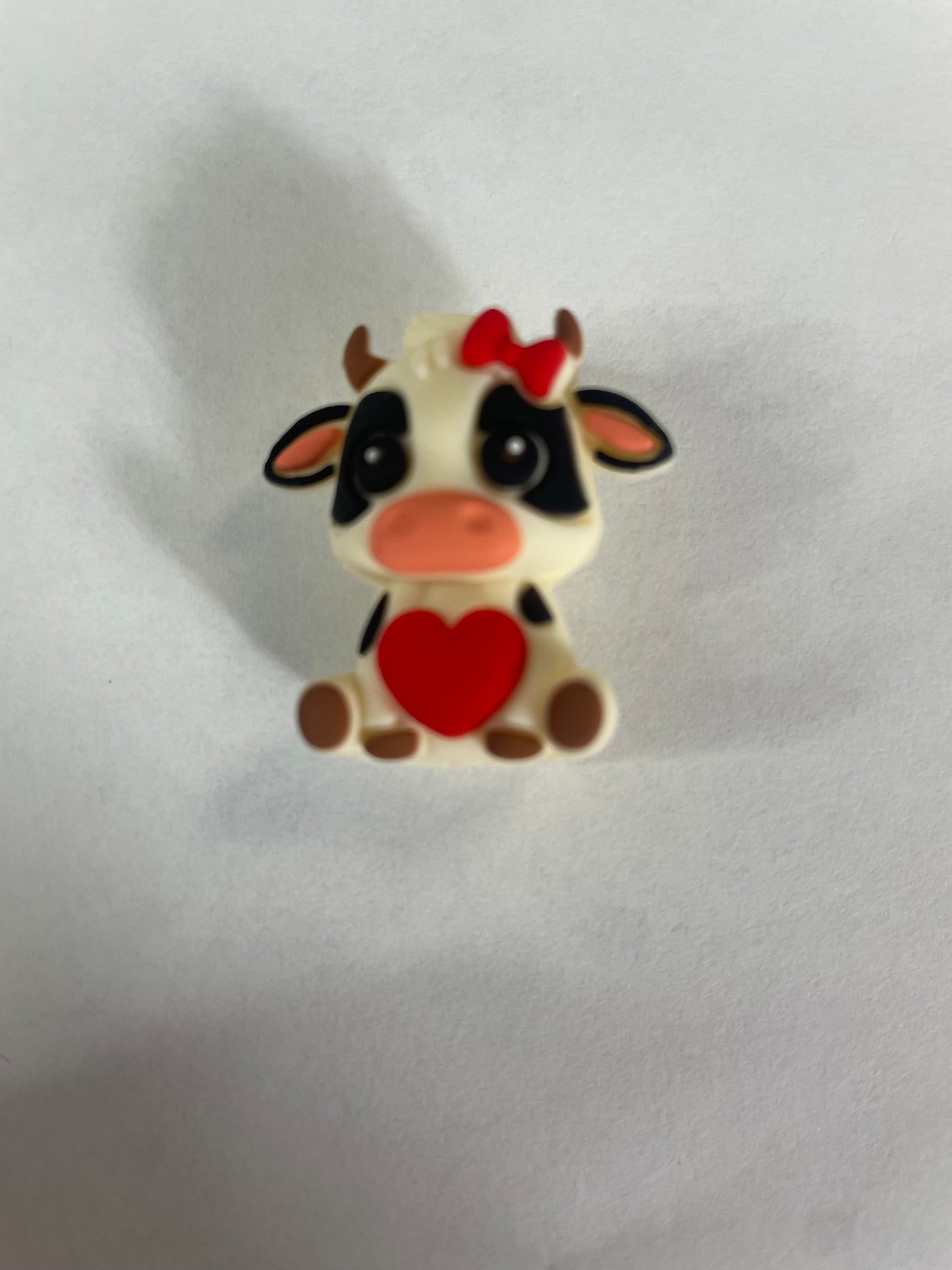 Focal 3d highland cow with heart