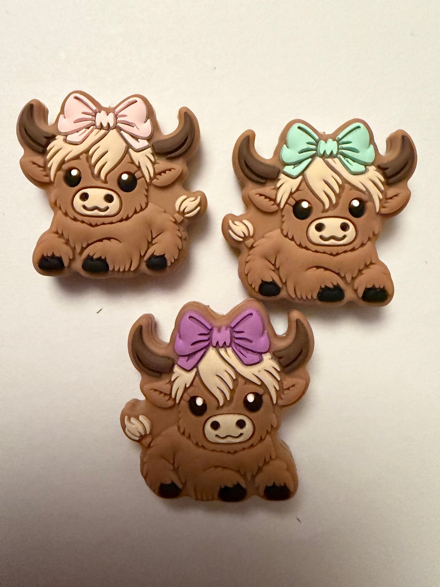 Focal 2d highland cow with bows mystery