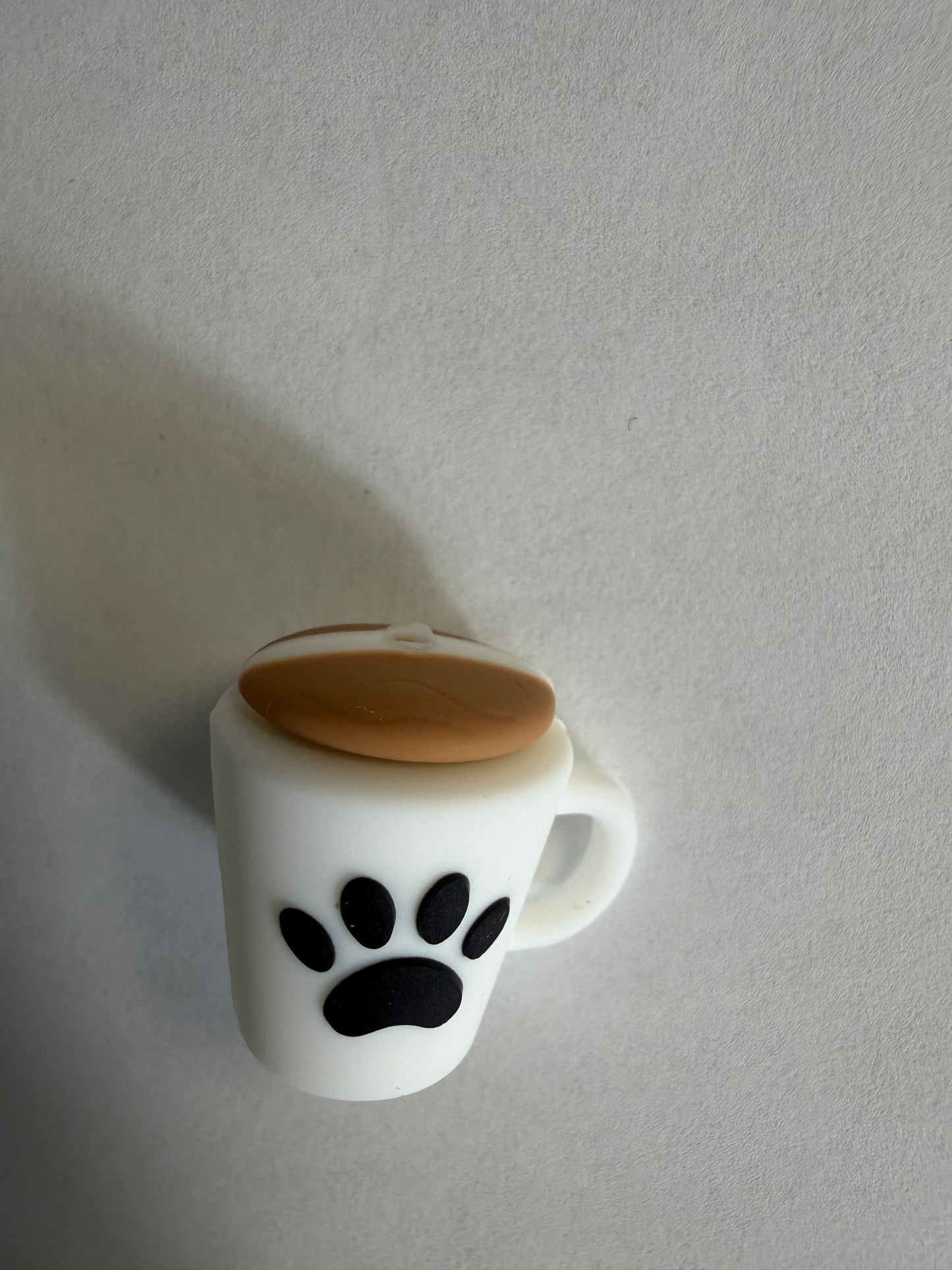 Focal 3d coffee cup with paw print on it