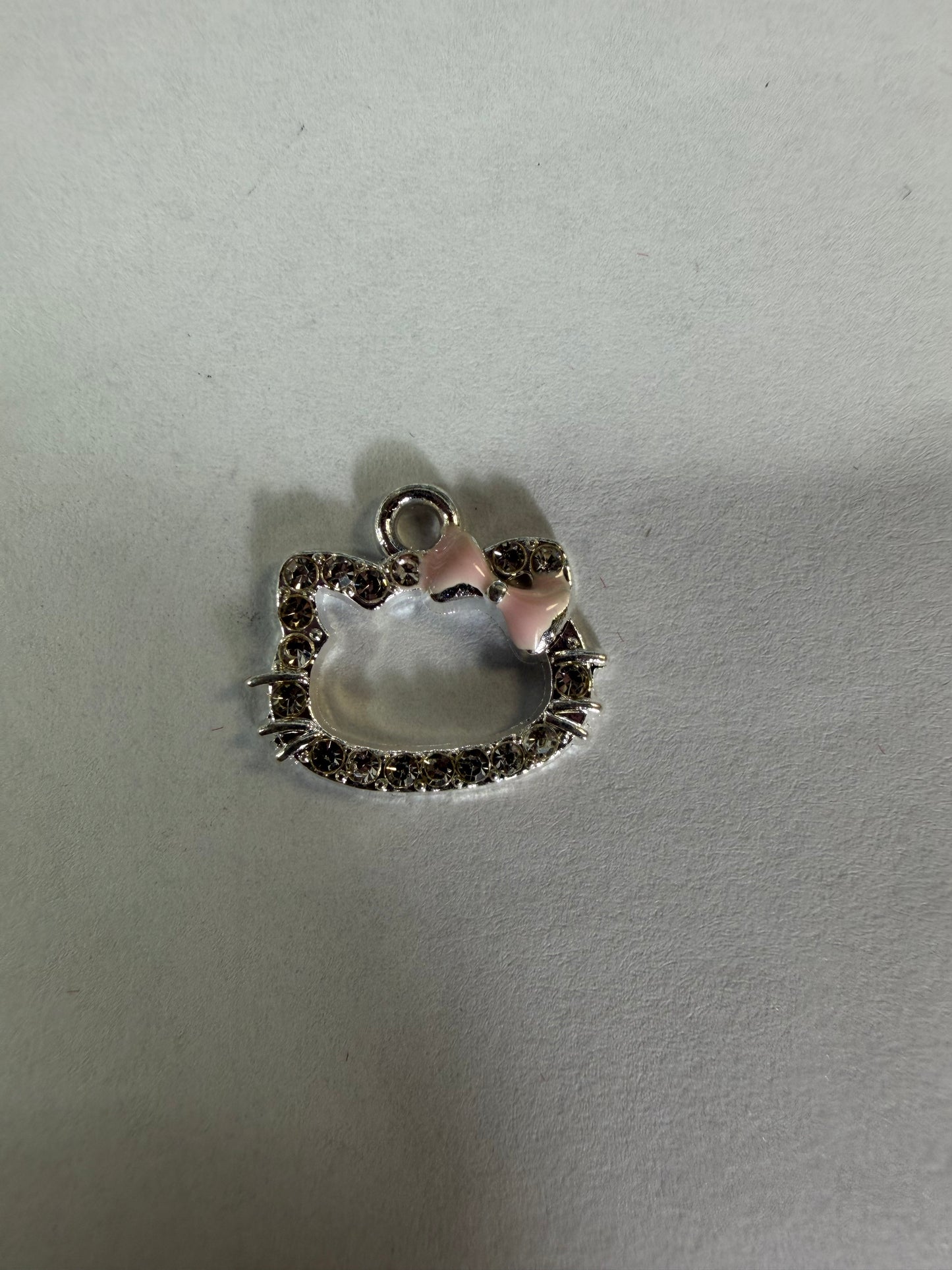 Charms hk head with pink bow and rhinestone
