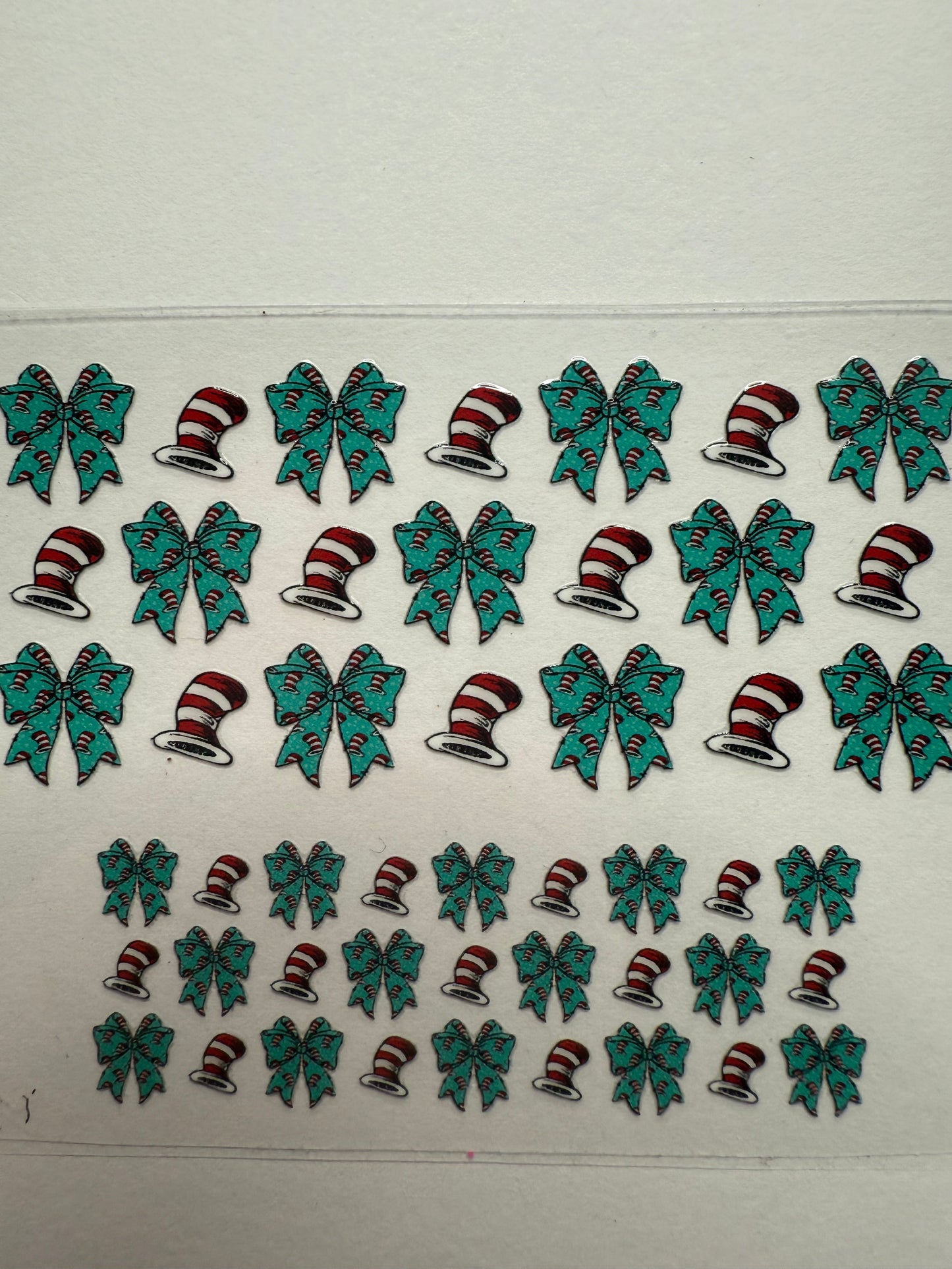 Uvdtf wraps Mini Stanley cat in the hat with teal bows