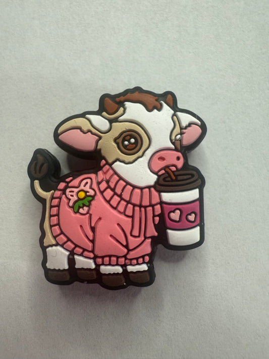 Focal 2d highland cow with pink sweater and coffee