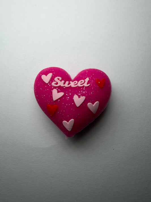 Focal 3d pink glitter heart with sweet on it